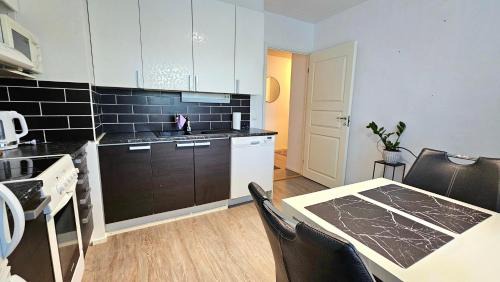 Tampere Apartment | Tilava kaksio, saunalla ja sähköauton latauksella.