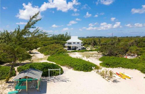 North Side House | Timmys Place - Charming Oceanfront Villa with Direct Beach Access and Scenic Views