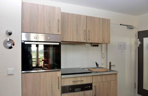 Wremen Apartment | Tolle Ferienwohnung in Strandnähe mit Sauna und Balkon mit Land- und Meerblick