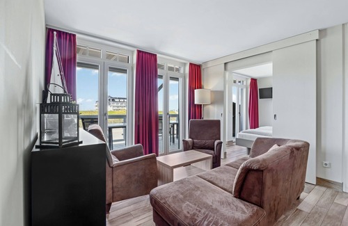 Wremen Apartment | Tolle Ferienwohnung in Strandnähe mit Sauna, Strandkorb u. Balkon mit Meerblick