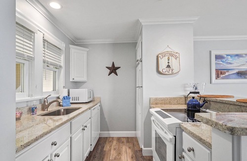 Boyne City Condo | Top-Floor Lake Charlevoix Condo | Private Beach Access | Gas-Log Fireplace