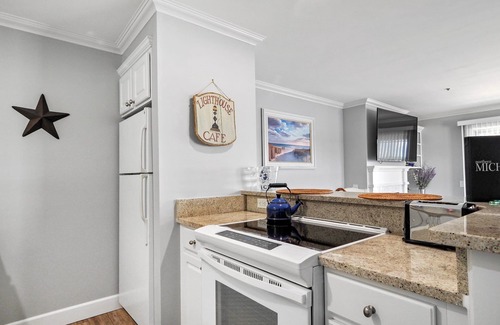Boyne City Condo | Top-Floor Lake Charlevoix Condo | Private Beach Access | Gas-Log Fireplace