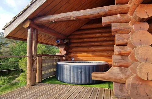 Camprieu Ski Chalet | Traditional log cabin with Jacuzzi and wooded garden in the Cévennes