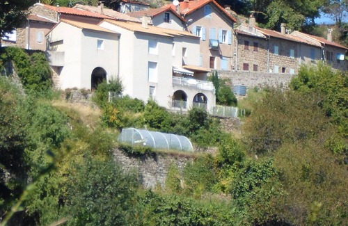 Saint-Pierreville House | Traditional blue-shuttered stone house in a stunning Ardeche mountain village.