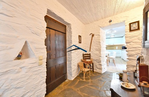 Koundouros Villa | Traditional stone built villa with a windmill and a swimming pool in Koundouros