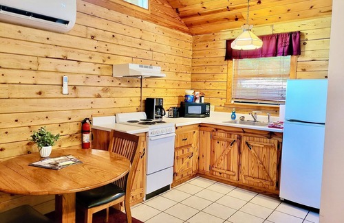 Eureka Springs Cabin | Tranquil Cabin- Perched on Mountain Top boasting jacuzzi for two and expansive deck with views! Trail & Cave on Property!