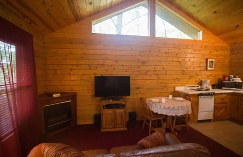 Eureka Springs Cabin | Tranquil Cabin- Perched on Mountain Top boasting jacuzzi for two and expansive deck with views! Trail & Cave on Property!