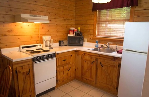Eureka Springs Cabin | Tranquil Cabin- Perched on Mountain Top boasting jacuzzi for two and expansive deck with views! Trail & Cave on Property!
