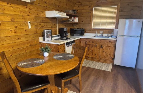 Eureka Springs Cabin | Tranquil Cabin- Perched on Mountain Top boasting jacuzzi for two and expansive deck with views! Trail & Cave on Property!