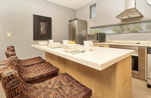 Playacar Fase II Apartment | Tranquil Stay with Pool, Private Terrace, and BBQ