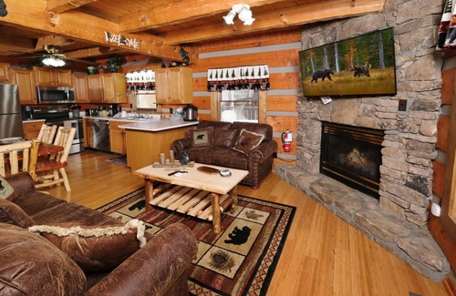 Gatlinburg - Pigeon Forge Cabin | Treasure Pines - Cozy cabin charm, outdoor firepit, steamy hot tub, and games!