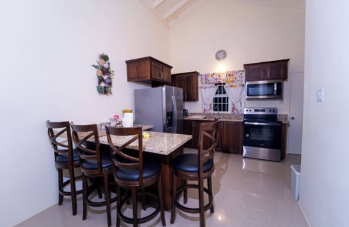 Falmouth House | Tropical Escape, Spacious 2 Bedroom Vacation Oasis with WiFi, AC