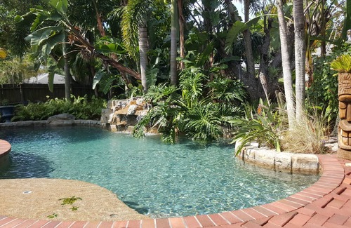 Bradenton House | Tropical bungalow oasis; heated pool with rock waterfall and hot tub. Sleeps 8!