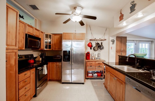 Cypress Point House | Tropical Getaway! Walking distance to beach & dining, private home, heated pool.