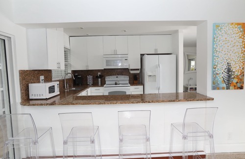 Melaleuca Gardens House | Tropical home with panoramic view of the canal. Fishing getaway near the ocean!