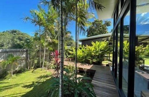 Mission Beach House | Tropical Modernist Retreat is set up as a contemporary beach abode