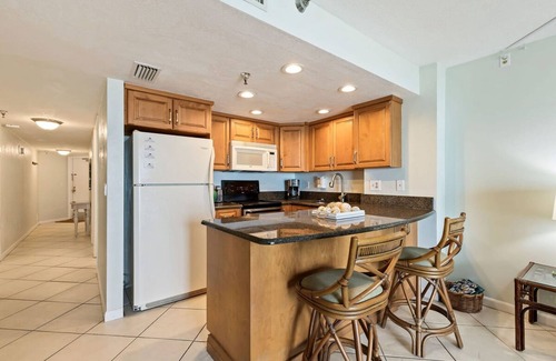 Daytona Beach Shores Apartment | Tropical Palms Partial Ocean View Pool Hot Tub