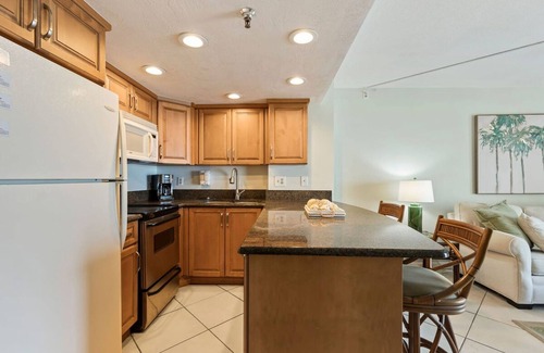 Daytona Beach Shores Apartment | Tropical Palms Partial Ocean View Pool Hot Tub