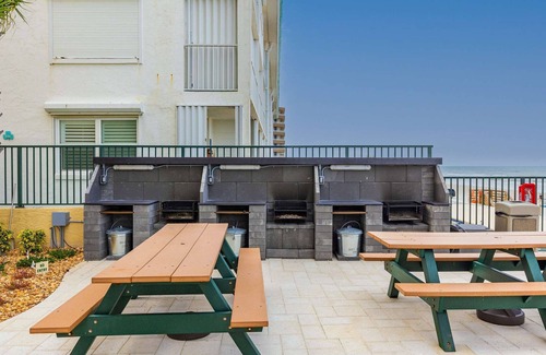 Daytona Beach Shores Apartment | Tropical Palms Partial Ocean View Pool Hot Tub