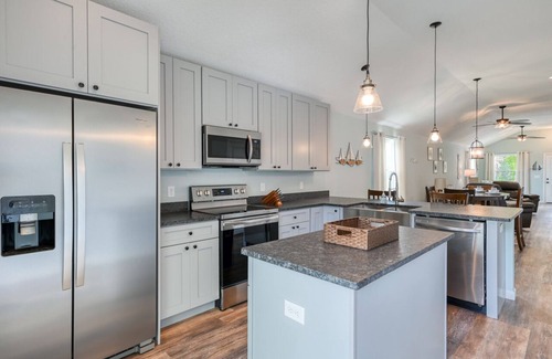 Butler Beach House | Tropical Winds - Heated Pool & Firepit! Walk to the Beach!