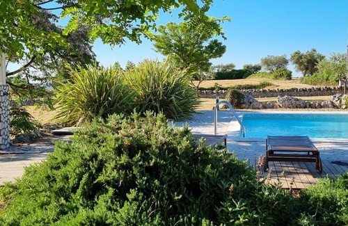 Alberobello Villa | Trulli Bianchi. Characteristic stone trullo with private pool and panoramic view