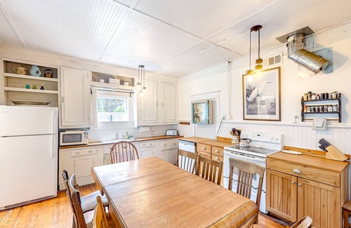 Bandon House | Turn-of-the-century home near beaches with porch, fenced yard & fireplace
