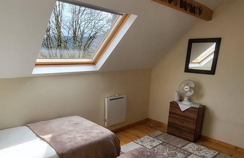 Bersac-sur-Rivalier Bed & Breakfast | Twin room ensuite with views across the valley and Ambersac mountains.