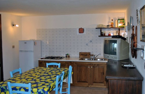 Sant'Antioco Villa | Two adjoining apartments sleeps 8/10, veranda, barbecue and olive garden