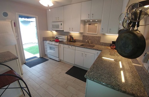 Crown Point Cottage | Two bedroom beach cottage in PB with AC. Parking, patio, garage. Walk to beach.