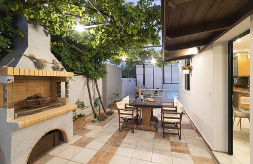 Koutsouras Condo | Two bedroom luxury condo with private patio with vineyard & BBQ near beach