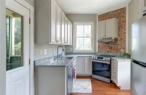 Beach Institute House | Two-story historic home along quiet streets and a gated courtyard. Free parking.