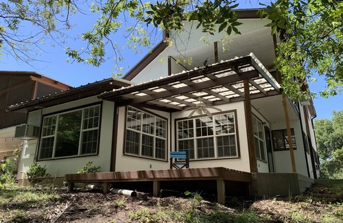 Brackettville House | Two story home with Las Moras Creek views
