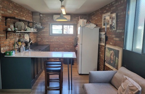 Itaewon Apartment | Unique Exposed Brick 2 Bed Lg open Kitchen w/gym