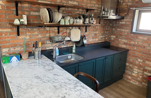 Itaewon Apartment | Unique Exposed Brick 2 Bed Lg open Kitchen w/gym