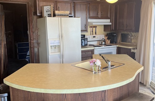 Howe Cottage | Unique Lakeside Retreat with Pedal Boat for a Relaxed, Pet-Friendly Getaway!