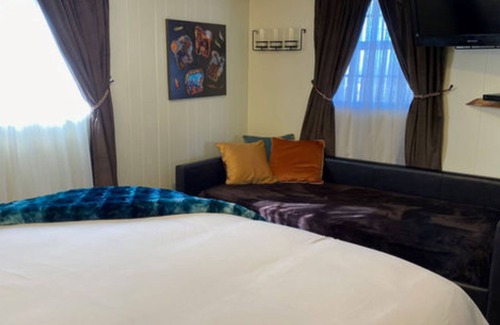 Cedaredge Cabin | Unit 9 at the Cedaredge Lodge: Creekside Comfort with a Touch of Mountain Magic.
