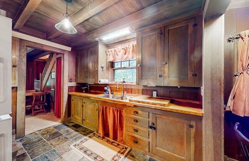 Marmot Apartment | Unwind in nature's embrace at a 1925 cabin with hot tub & river views