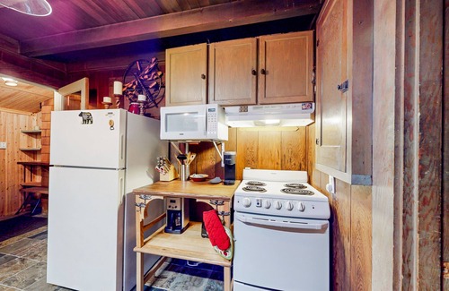 Marmot Apartment | Unwind in nature's embrace at a 1925 cabin with hot tub & river views