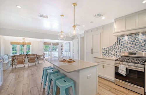 Holmes Beach House | Unwind Sunshine - heated pool, steps to the local's favorite beach, free bikes
