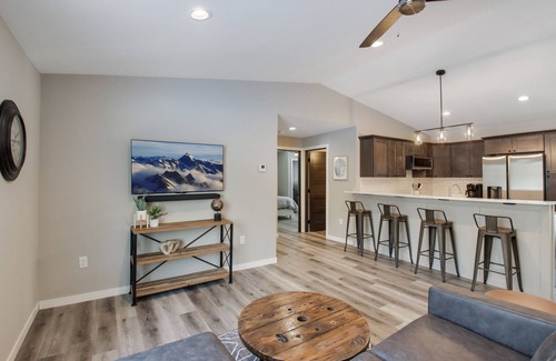 Cumberland Condo | Up North Living! Fully renovated one-level living home in wooded lot near lake.