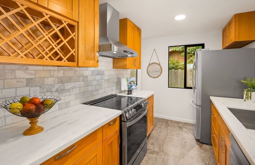 Rollingbay House | Updated beachfront home with private beach, water views, spacious deck, & W/D