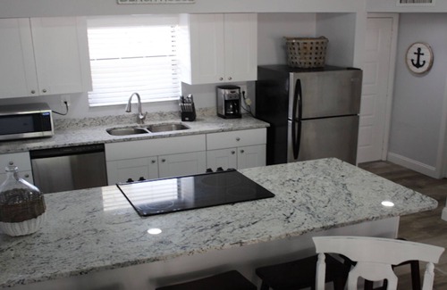 Marco Island Condo | Updated Cabana Unit with covered parking!7 night minimum.Now with washer dryer.