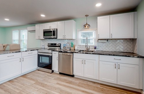 Montego Bay House | Updated dog-friendly home with gas grill, 2 pools, 2 tennis courts, fishing pier