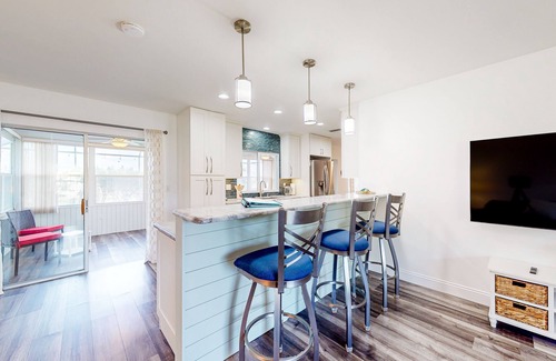 Bradenton House | Updated home with enclosed pool, open layout, grill, W/D, streaming, and AC