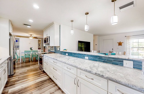 Bradenton House | Updated home with enclosed pool, open layout, grill, W/D, streaming, and AC