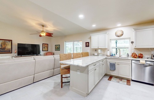 Caloosahatchee House | Updated home with private heated pool, enclosed lanai, patio, grill