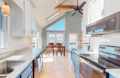 Livingston House | Updated lakefront home & studio with water views, beach, dock & game room
