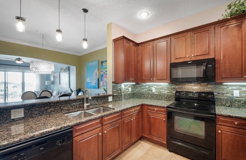 Palm Coast Condo | Updated waterfront condo just steps from the beach with beachfront pool and hot tub