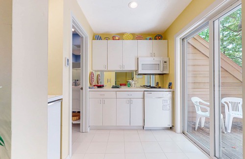 Maple City Condo | Upper-level condo with forest views, fireplace, soaking tub & high-speed WiFi