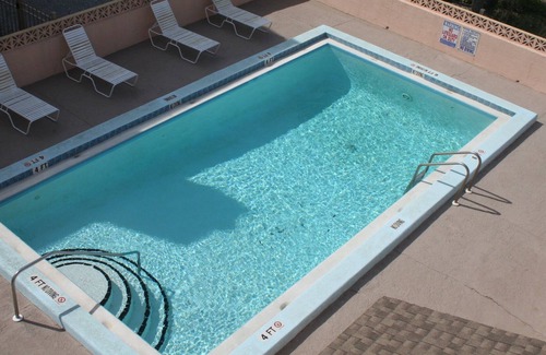 Pensacola Beach Condo | Upscale condo just steps to the white sand and emerald-green water!
